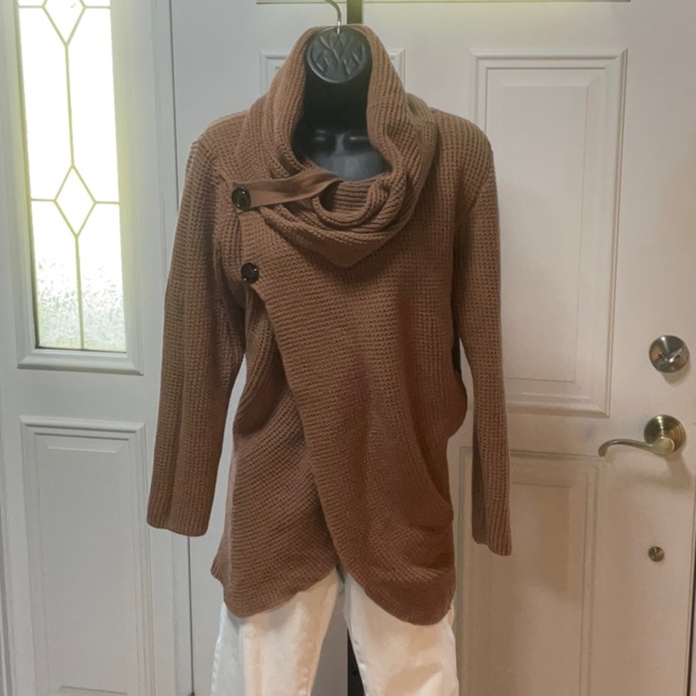 Size Med, med weight long sleeve tan sweater.